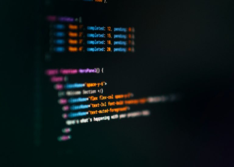 Computer screen showing lines of code on a dark background